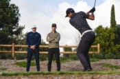 PGA coaches Piers and Andy watch Aaron Rai hit driver during golf lesson.